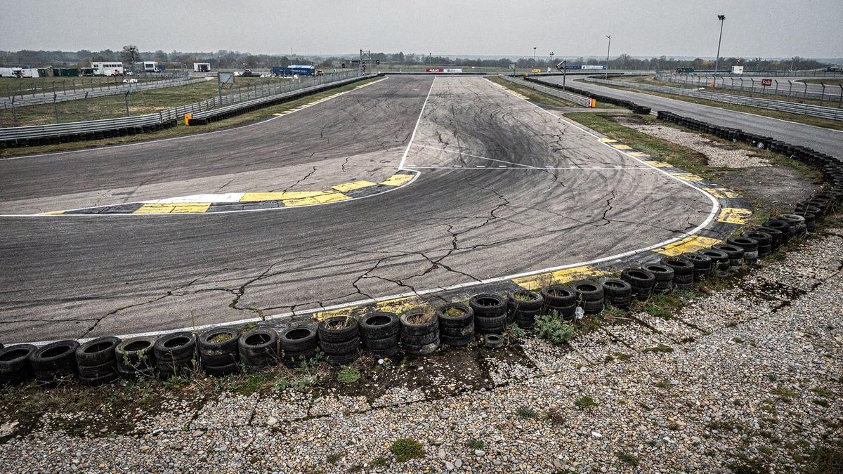 Closed asphalt circuit near Kyiv with marked corner entry lines and gravel run-off zones